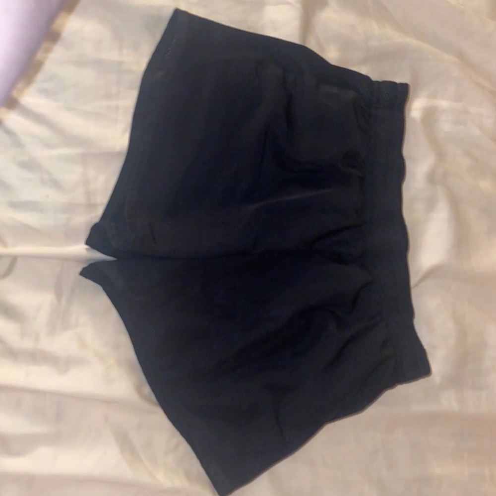 Black athletic shorts! Can fit women’s xs